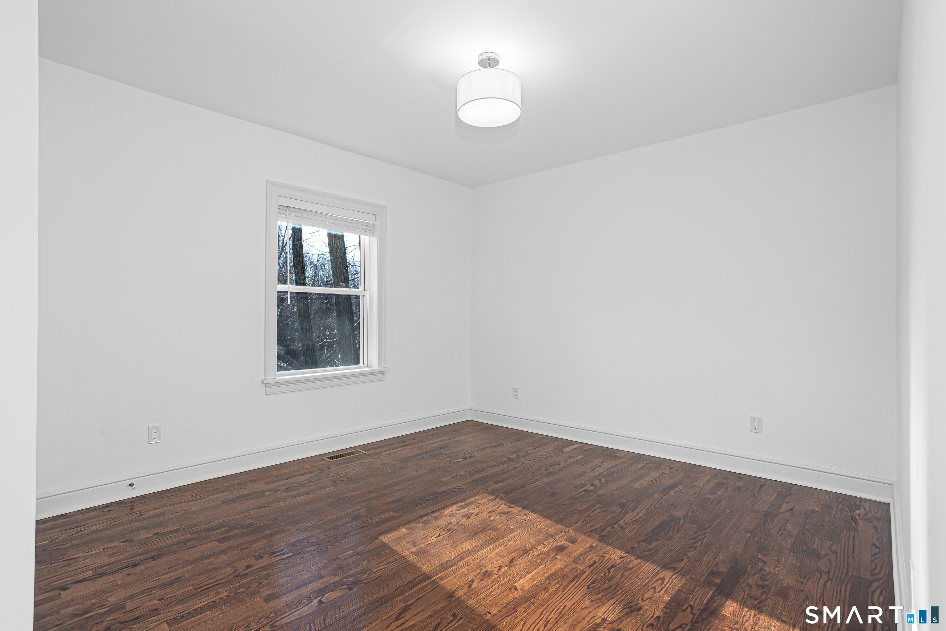 65 Mason Street Fairfield, CT 06825 - Photo 14 of 30 wooden floor in an empty room with a window