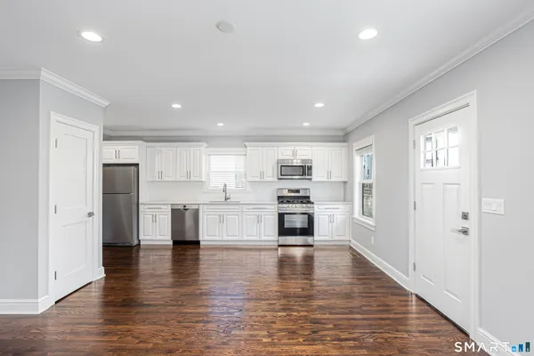 a view of kitchen with wooden floor
