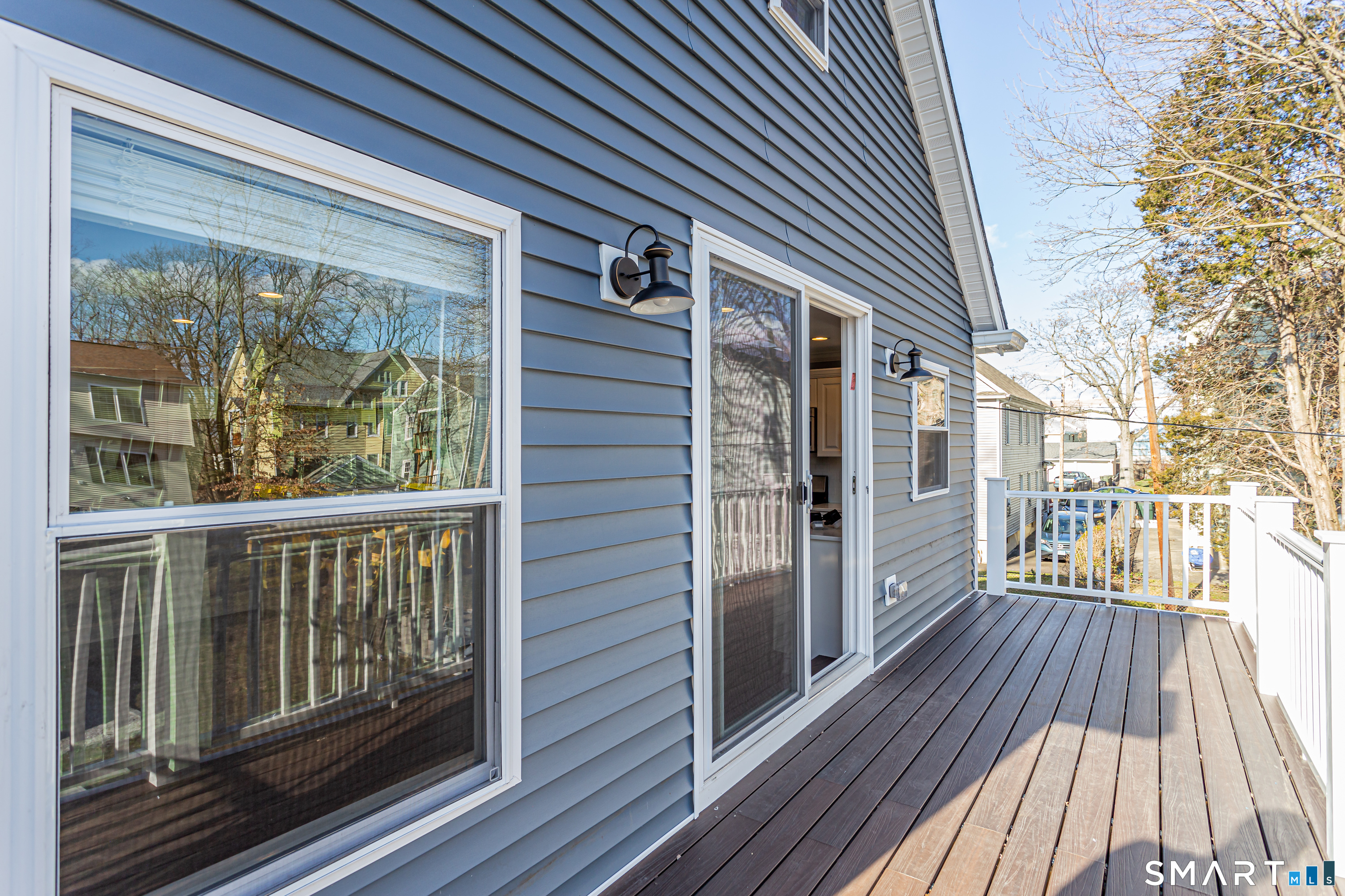 65 Mason Street Fairfield, CT 06825 - Photo 22 of 30 a view of a brick house with a large window