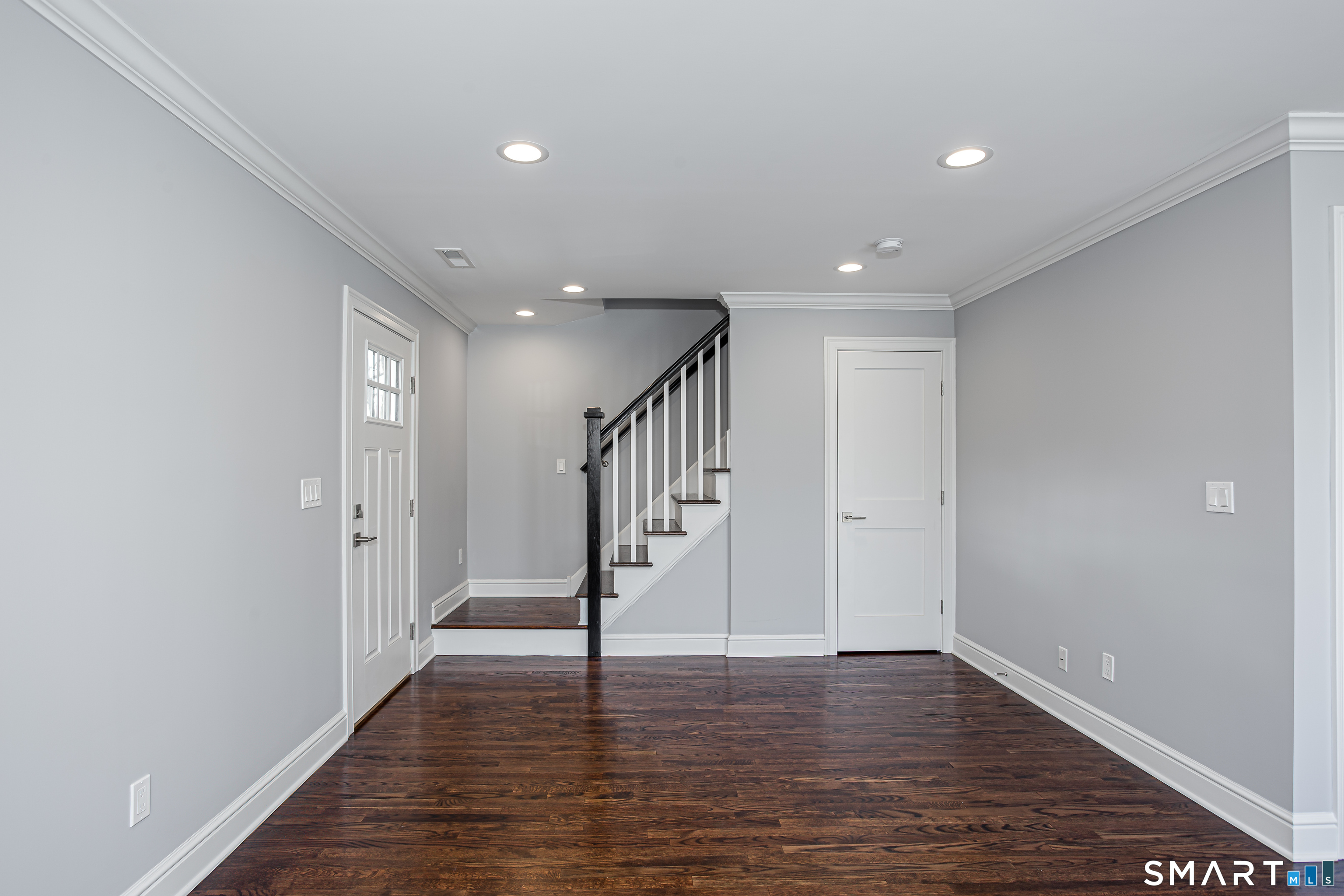65 Mason Street Fairfield, CT 06825 - Photo 23 of 30 a view of entryway with wooden floor