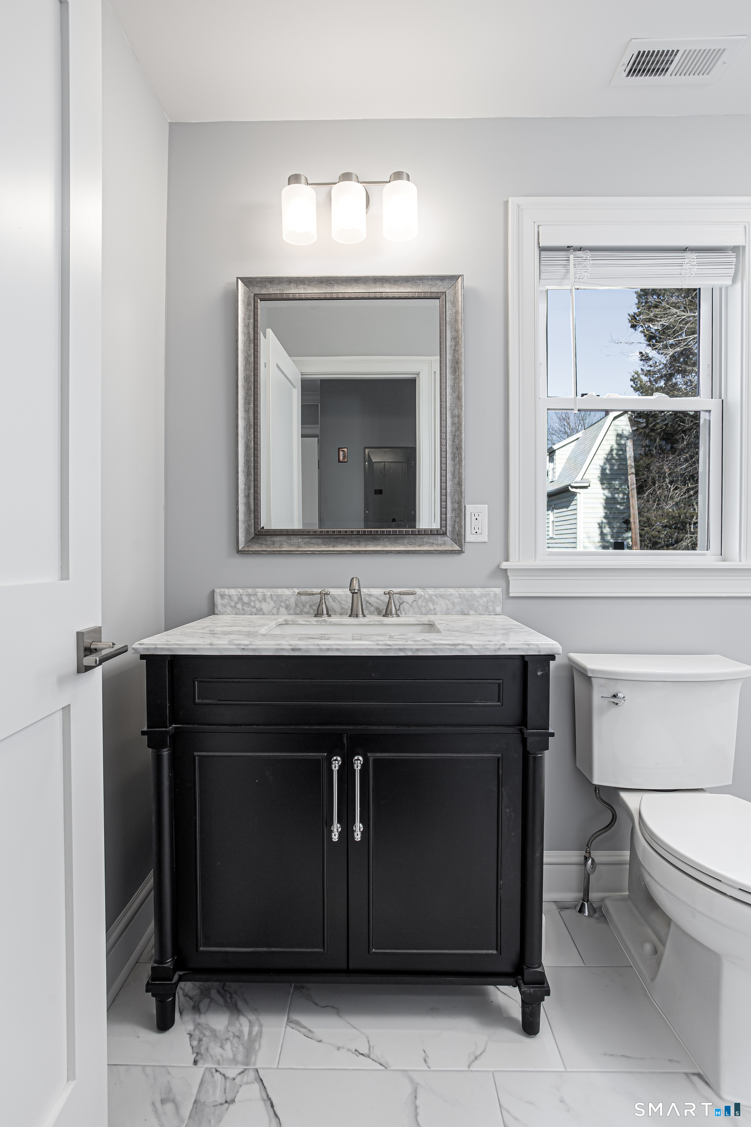 65 Mason Street Fairfield, CT 06825 - Photo 25 of 30 a bathroom with a sink and a mirror