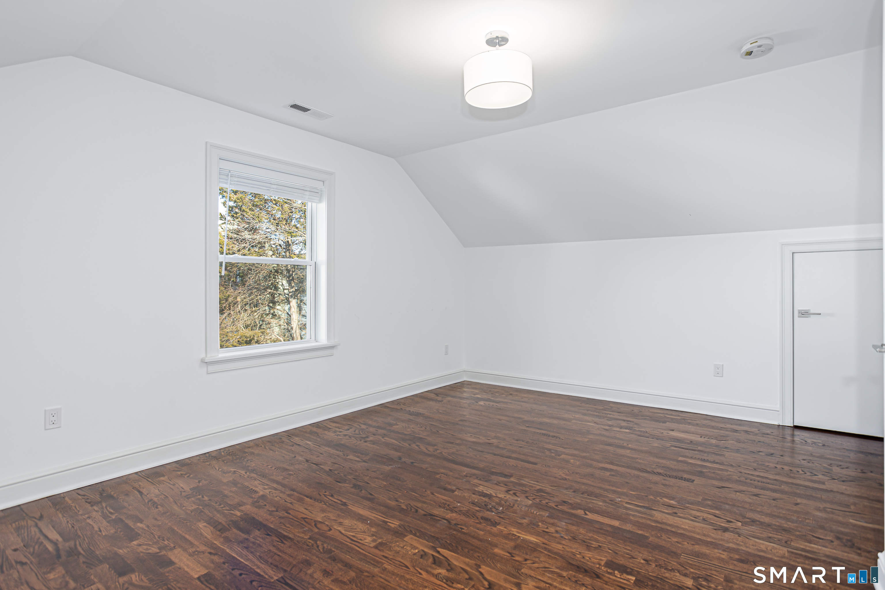 65 Mason Street Fairfield, CT 06825 - Photo 30 of 30 an empty room with wooden floor and windows