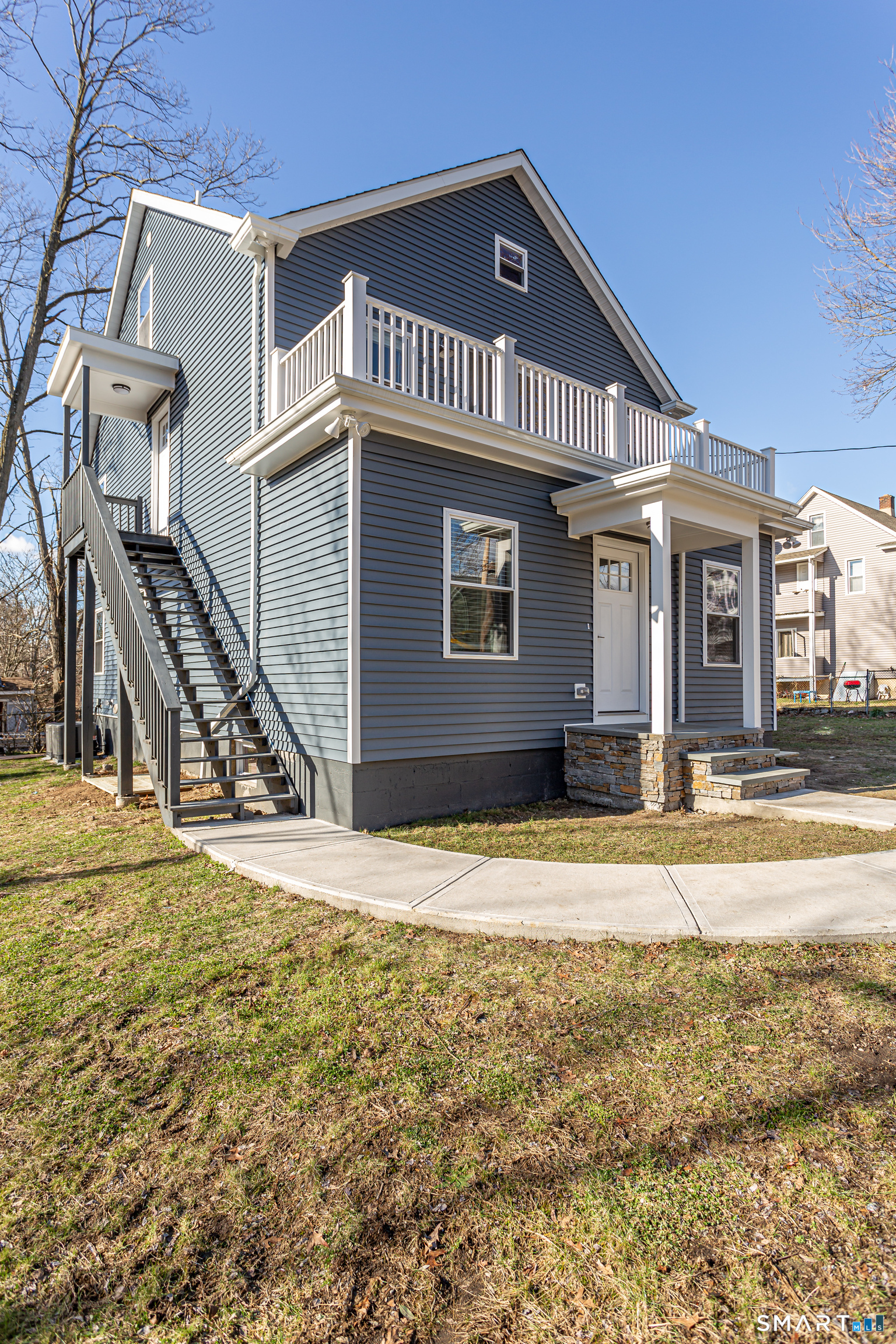 65 Mason Street Fairfield, CT 06825 - Photo 3 of 30 a front view of a house with a yard