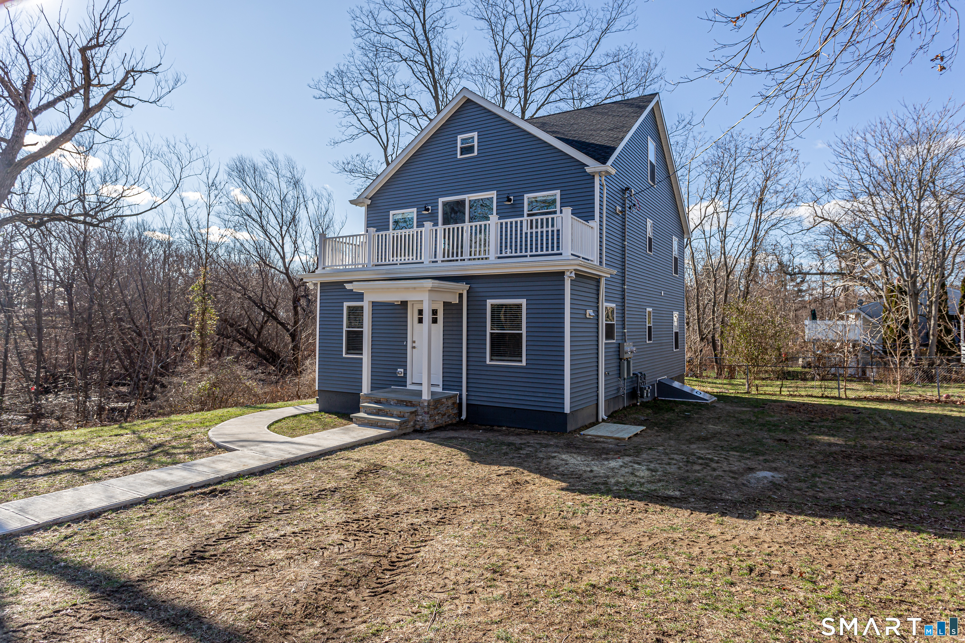 65 Mason Street Fairfield, CT 06825 - Photo 4 of 30 a front view of a house with a yard