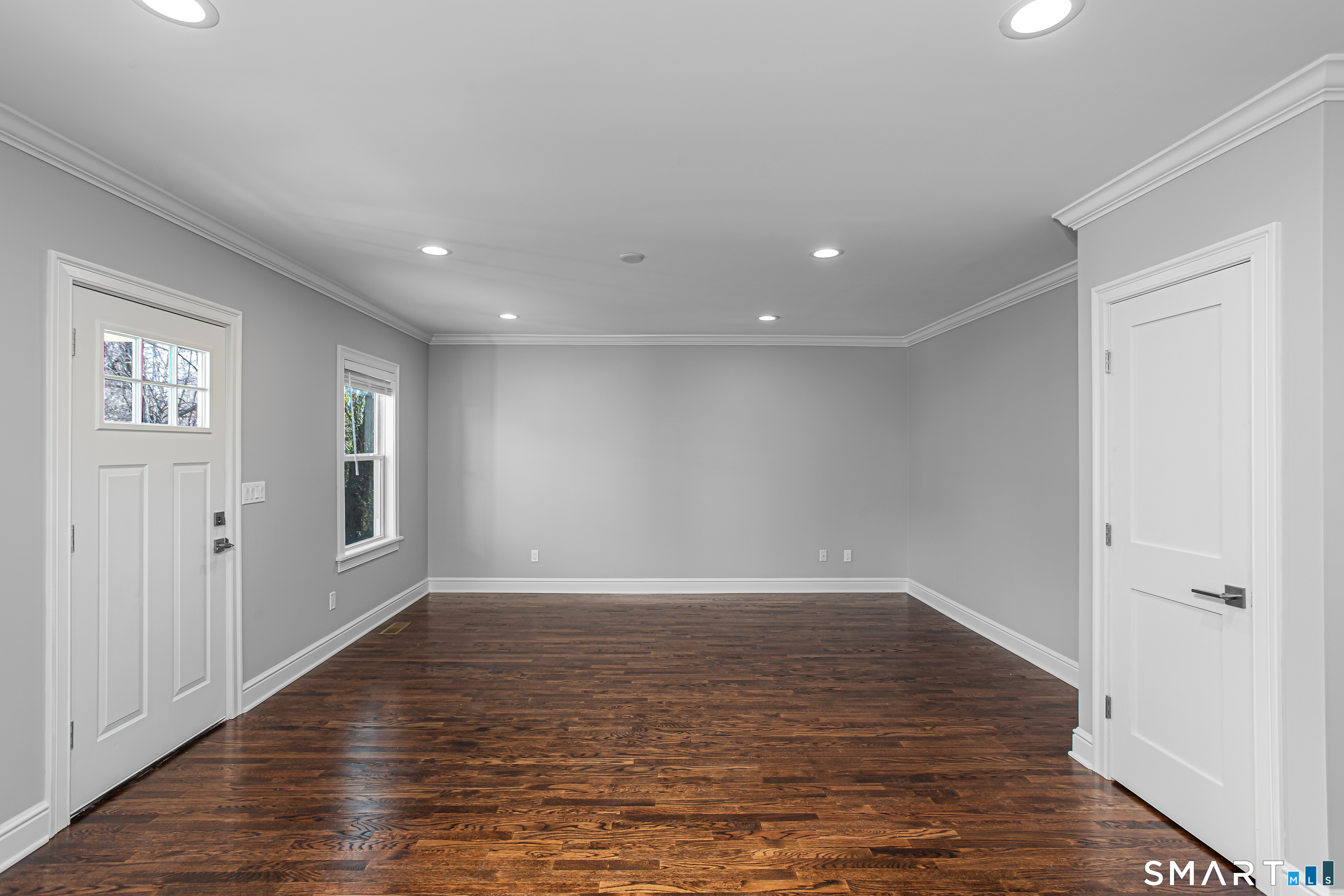 65 Mason Street Fairfield, CT 06825 - Photo 8 of 30 an empty room with wooden floor and windows