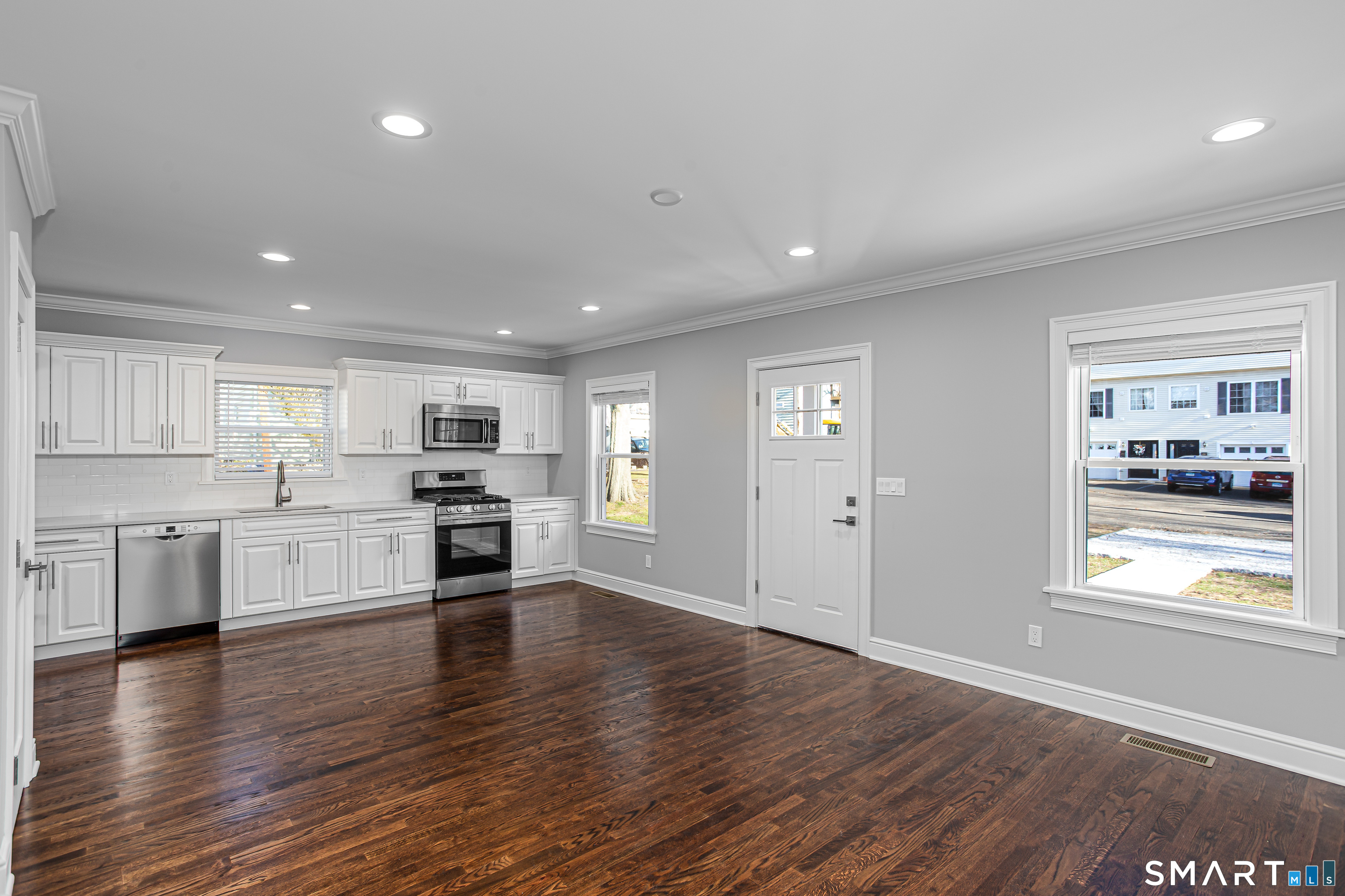 65 Mason Street Fairfield, CT 06825 - Photo 9 of 30 a open kitchen with stove and wooden floor