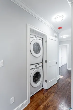 a view of a hallway with washer and dryer