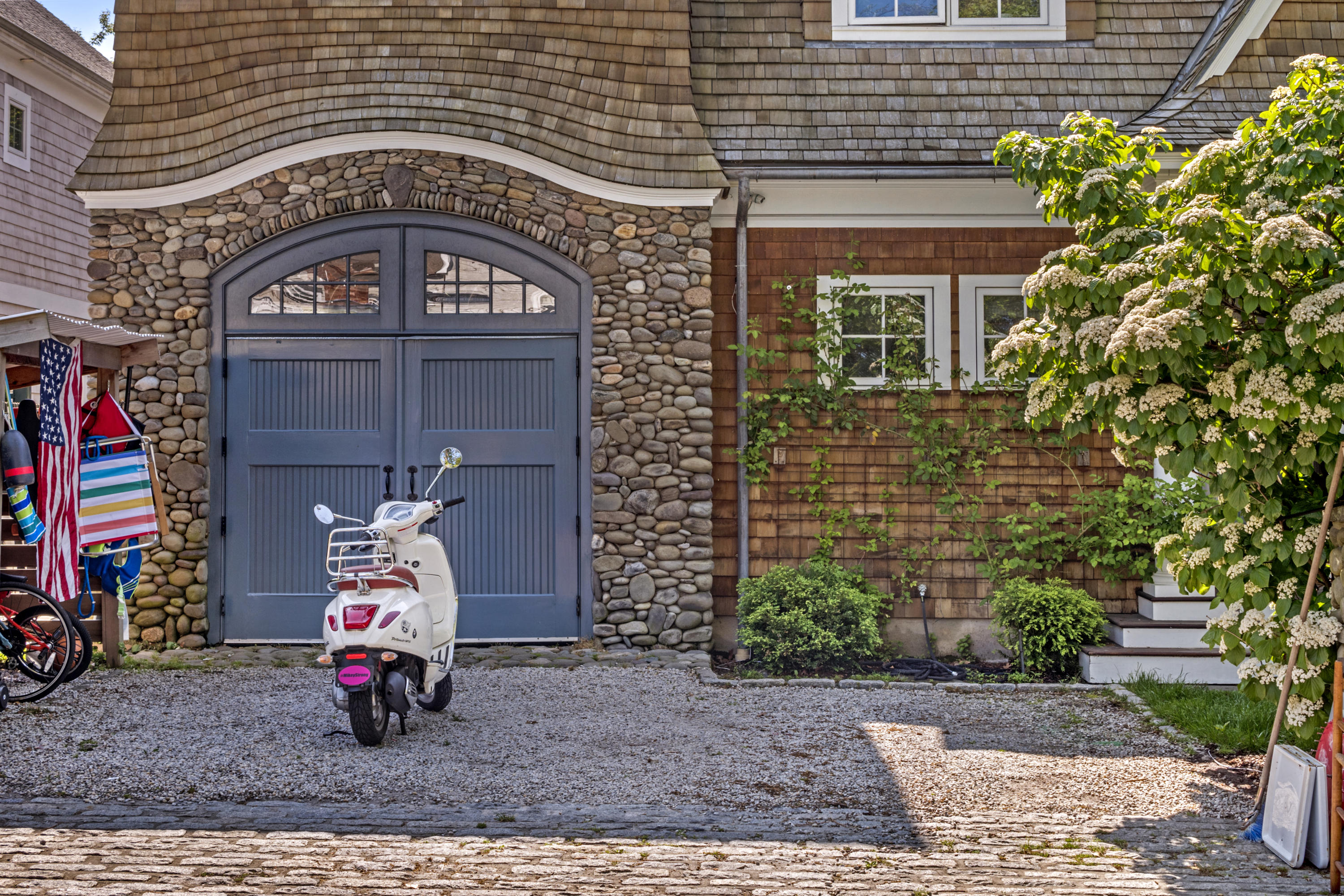 29 Pine Point Road Rowayton, CT 06853 - Photo 21 of 21 a view of a brick house with plants and a clock