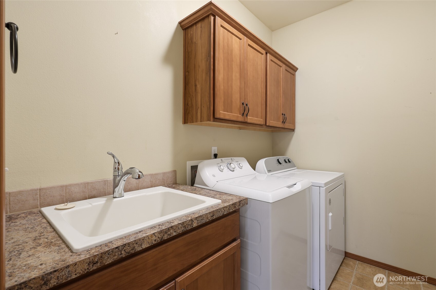5107 66th Avenue Southeast Lacey, WA 98513 - Photo 12 of 27 a bathroom with a sink and a mirror