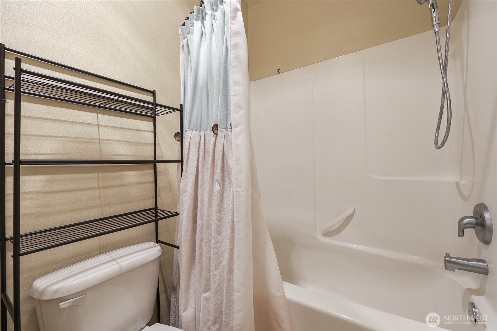 5107 66th Avenue Southeast Lacey, WA 98513 - Photo 17 of 27 a bathroom with a shower and a toilet