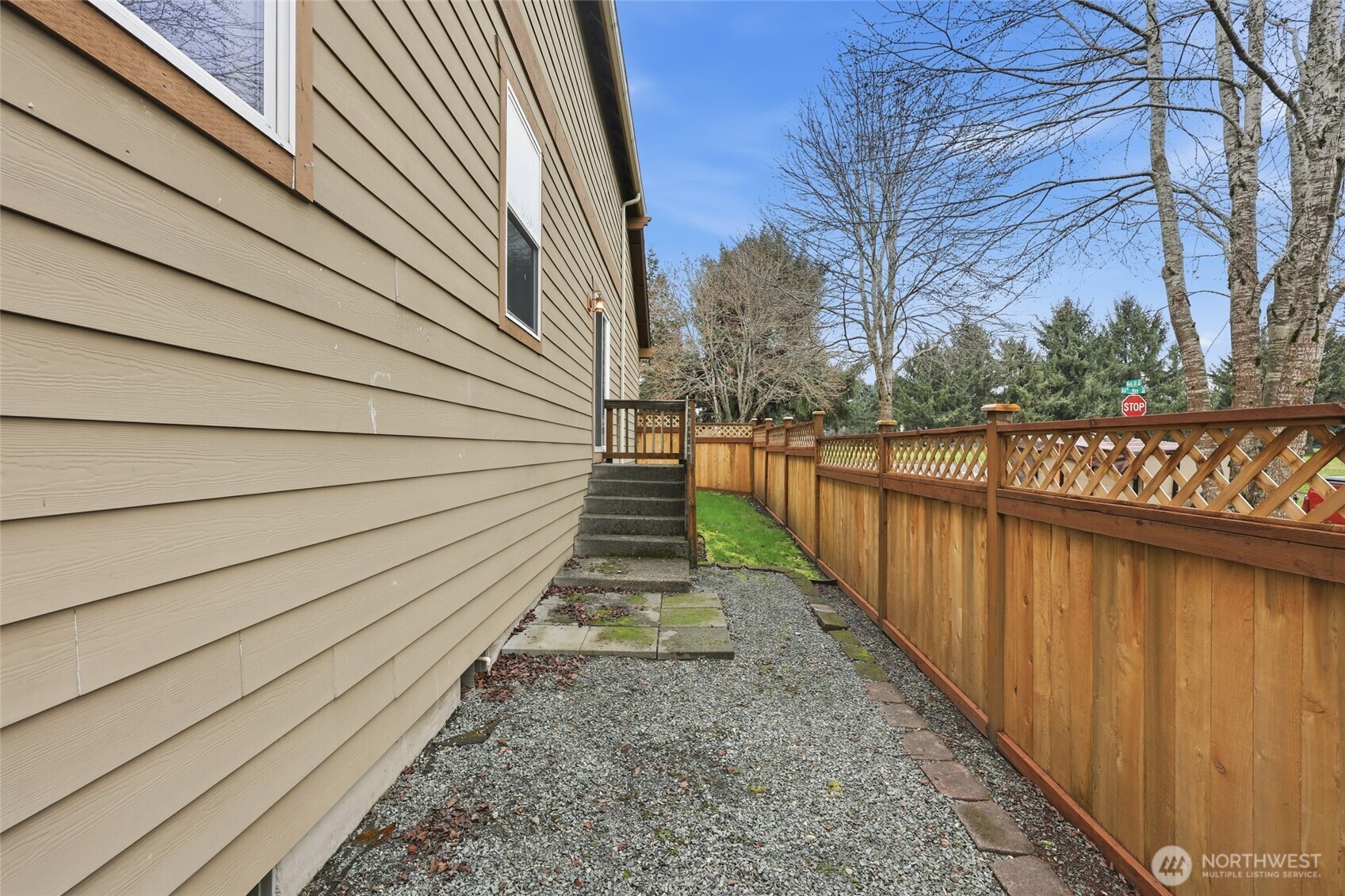 5107 66th Avenue Southeast Lacey, WA 98513 - Photo 27 of 27 a view of a pathway with a wrought fence