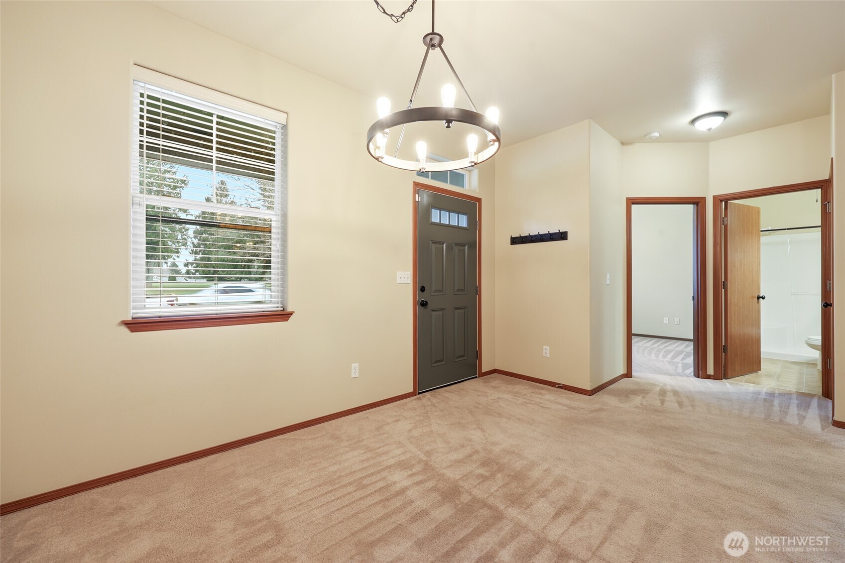 5107 66th Avenue Southeast Lacey, WA 98513 - Photo 6 of 27 a view of a livingroom with a chandelier fan and a window