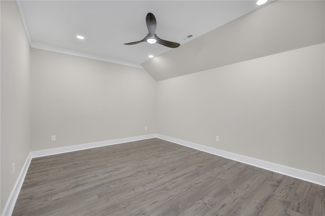 384 Jim Smith Road Pendleton, SC 29670 - Photo 26 of 48 Gleaming wood flooring complements the vaulted ceiling profile in this versatile upper-level space.