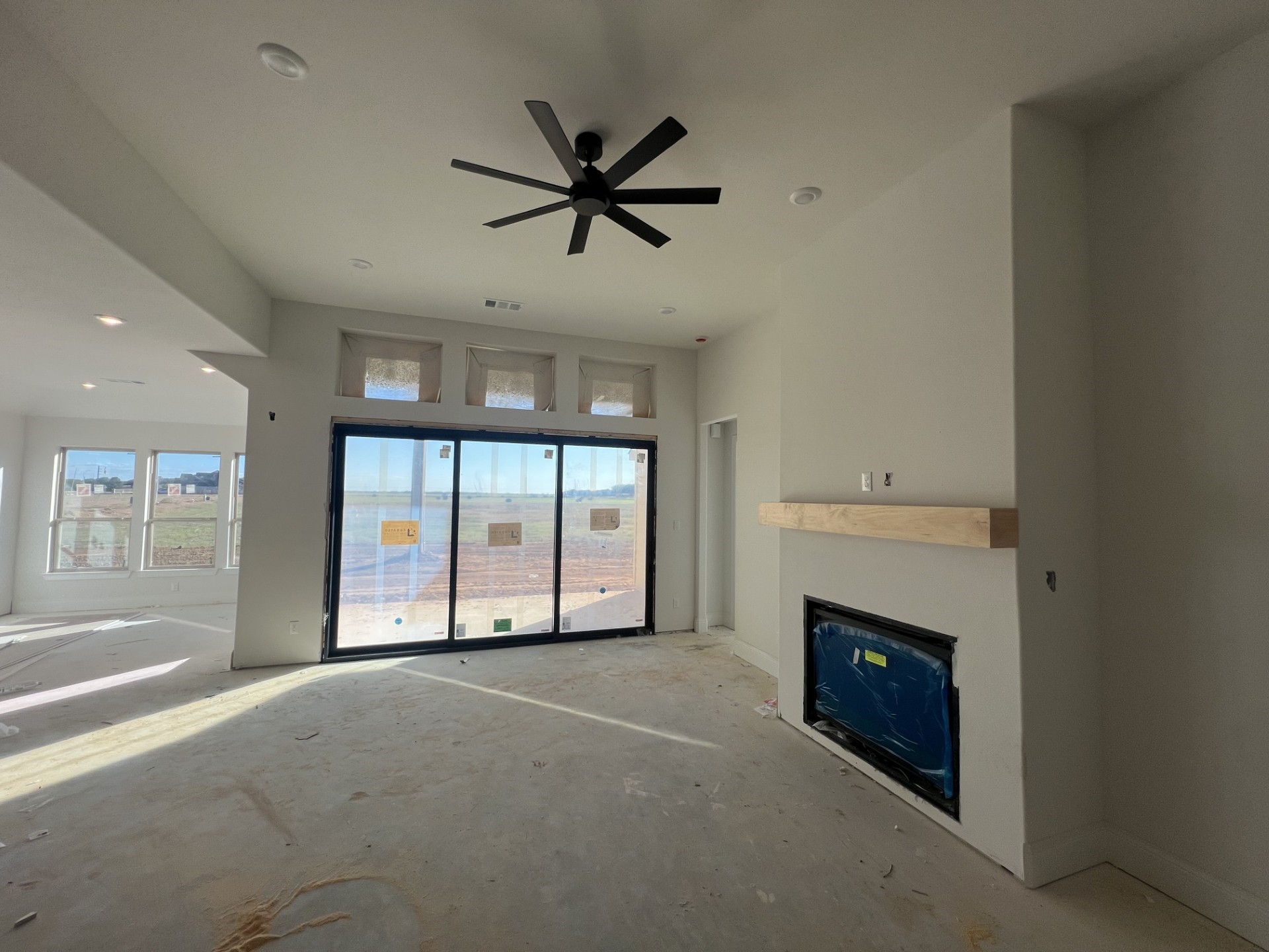 652 Cross Timbers Trace Hempstead, TX 77445 - Photo 5 of 13 a view of an empty room with a fireplace and a window