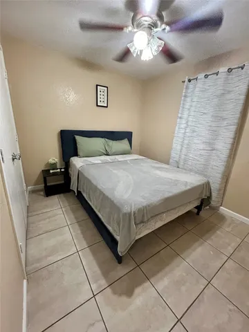 a bedroom with a bed and a walk in closet