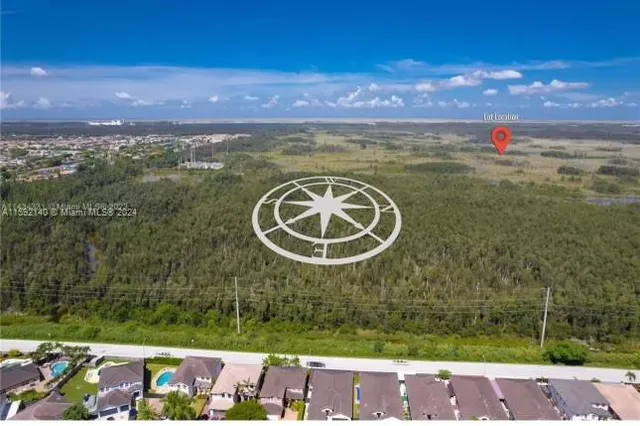 a view of a street with a yard