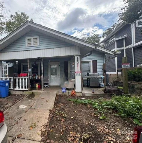 a front view of a house with sitting area