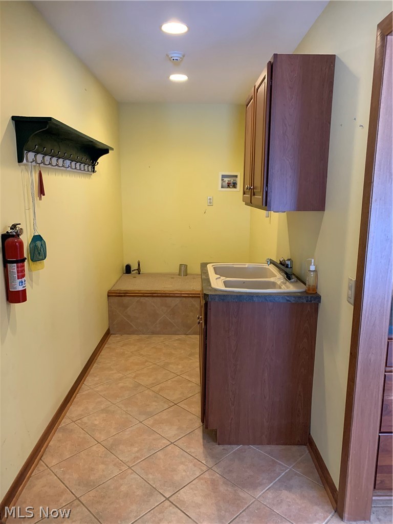5917 Mt Everett Road Hubbard, OH 44425 - Photo 15 of 26 Laundry room is directly across from master bedroom and has a platform for easy access to front load washer and dryer.