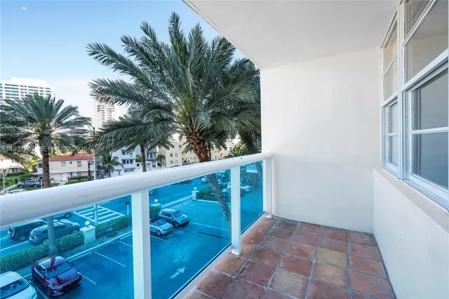 a view of balcony with a potted plant