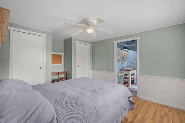 a bedroom with a large bed and a window