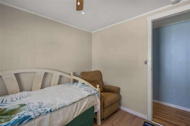 a living room with a couch and a chandelier