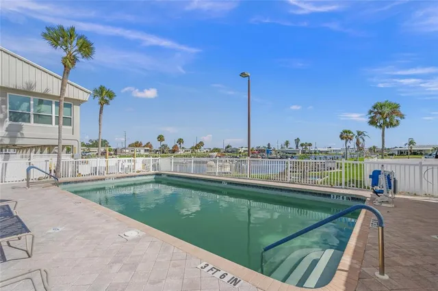 a view of a kitchen with kitchen island and a sink