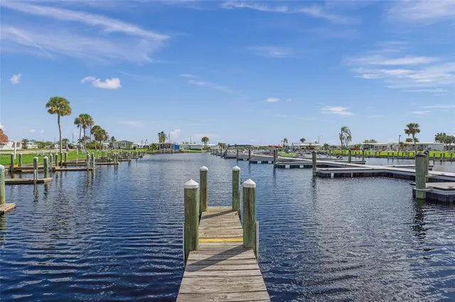 a view of a backyard with sitting area