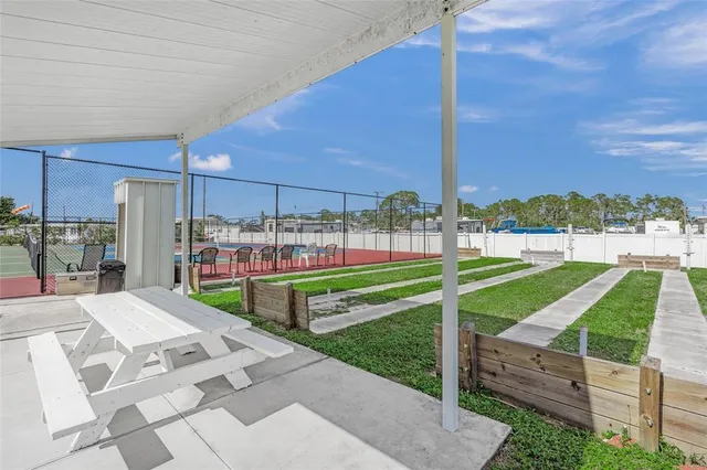 a view of a swimming pool and an outdoor space