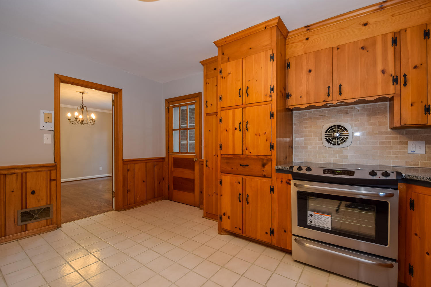 3075 Sedgefield Road Southwest Roanoke, VA 24018 - Photo 10 of 30 a kitchen with stainless steel appliances granite countertop a refrigerator and a stove