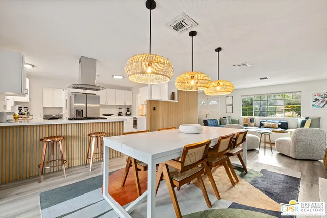 a view of a dining room with furniture window and outside view