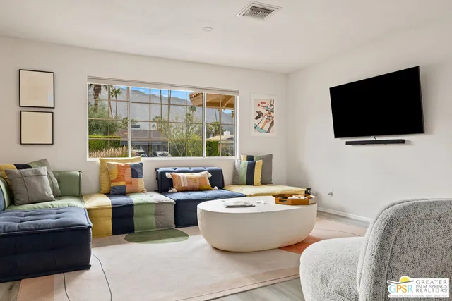 a living room with furniture and a table