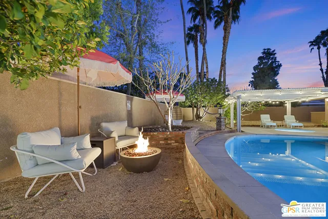 a view of a chairs and table in the patio