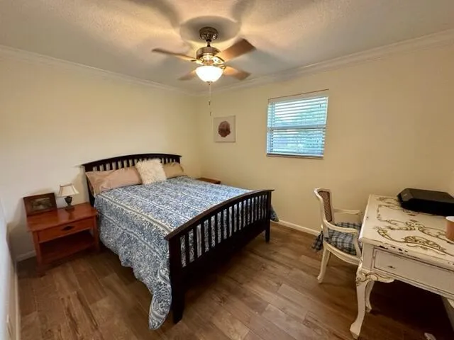 a bedroom with a bed and a table in it