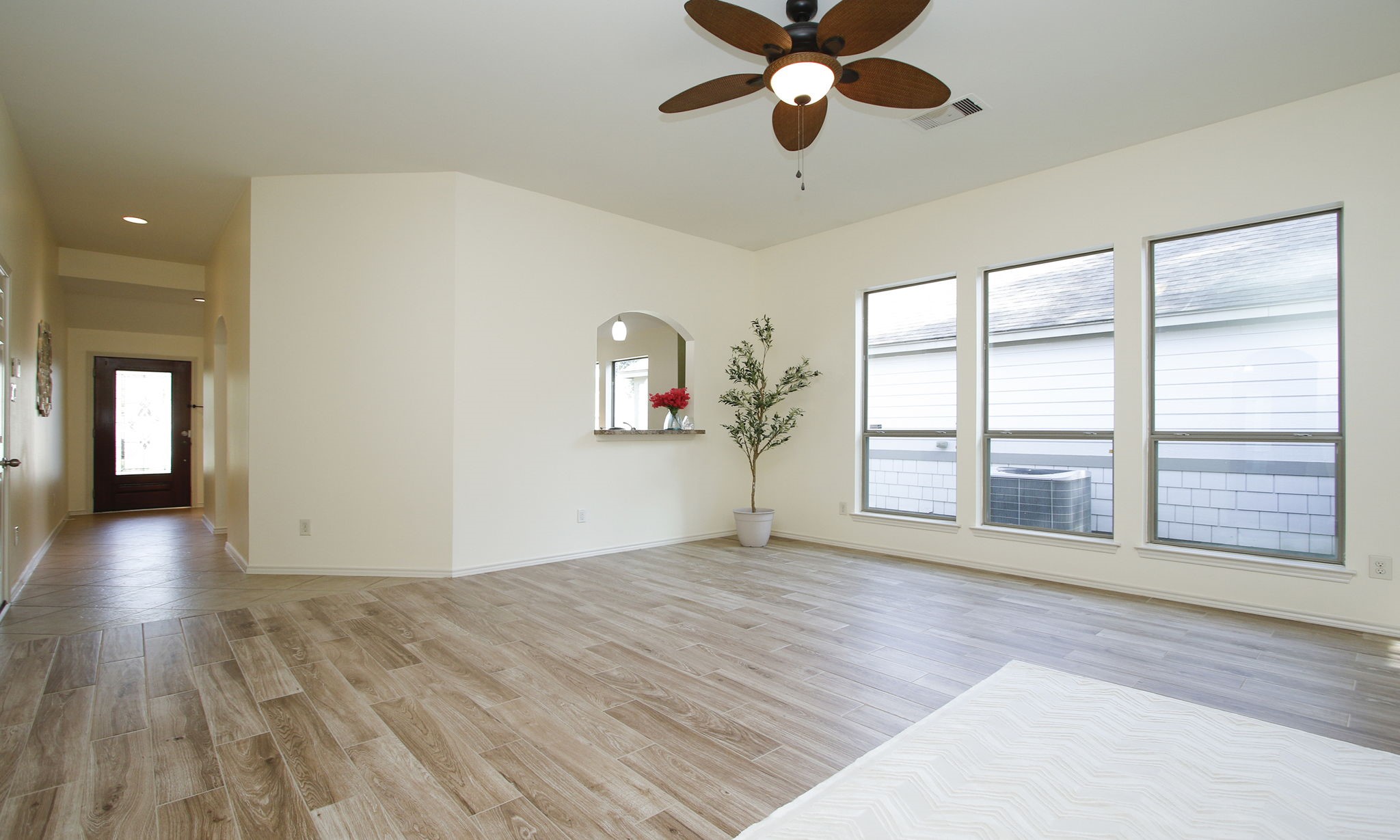 11123 Pembroke Ridge Drive Houston, TX 77065 - Photo 21 of 43 a view of an empty room with a window and wooden floor