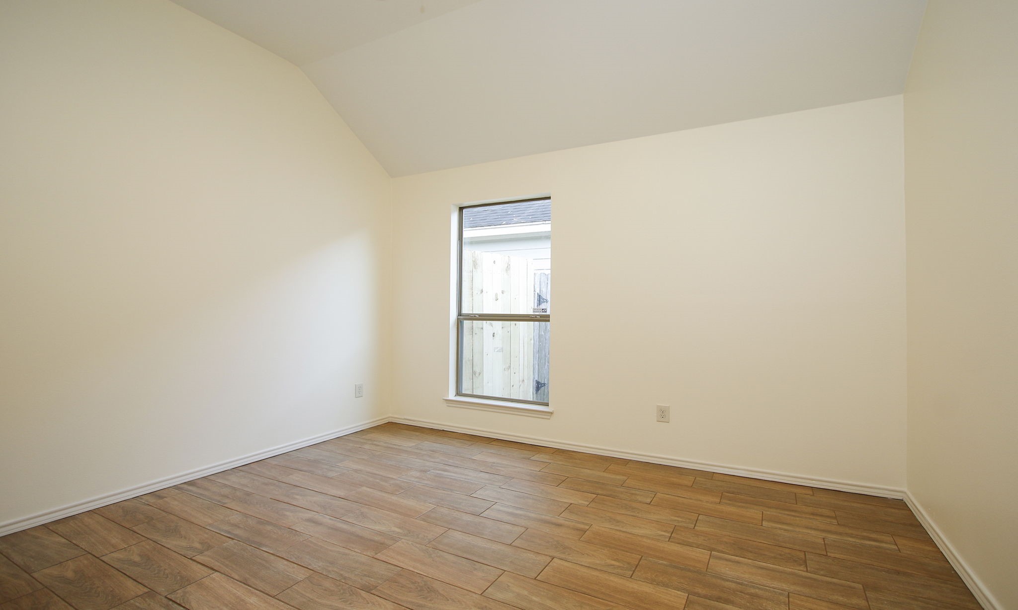 11123 Pembroke Ridge Drive Houston, TX 77065 - Photo 25 of 43 an empty room with wooden floor and windows