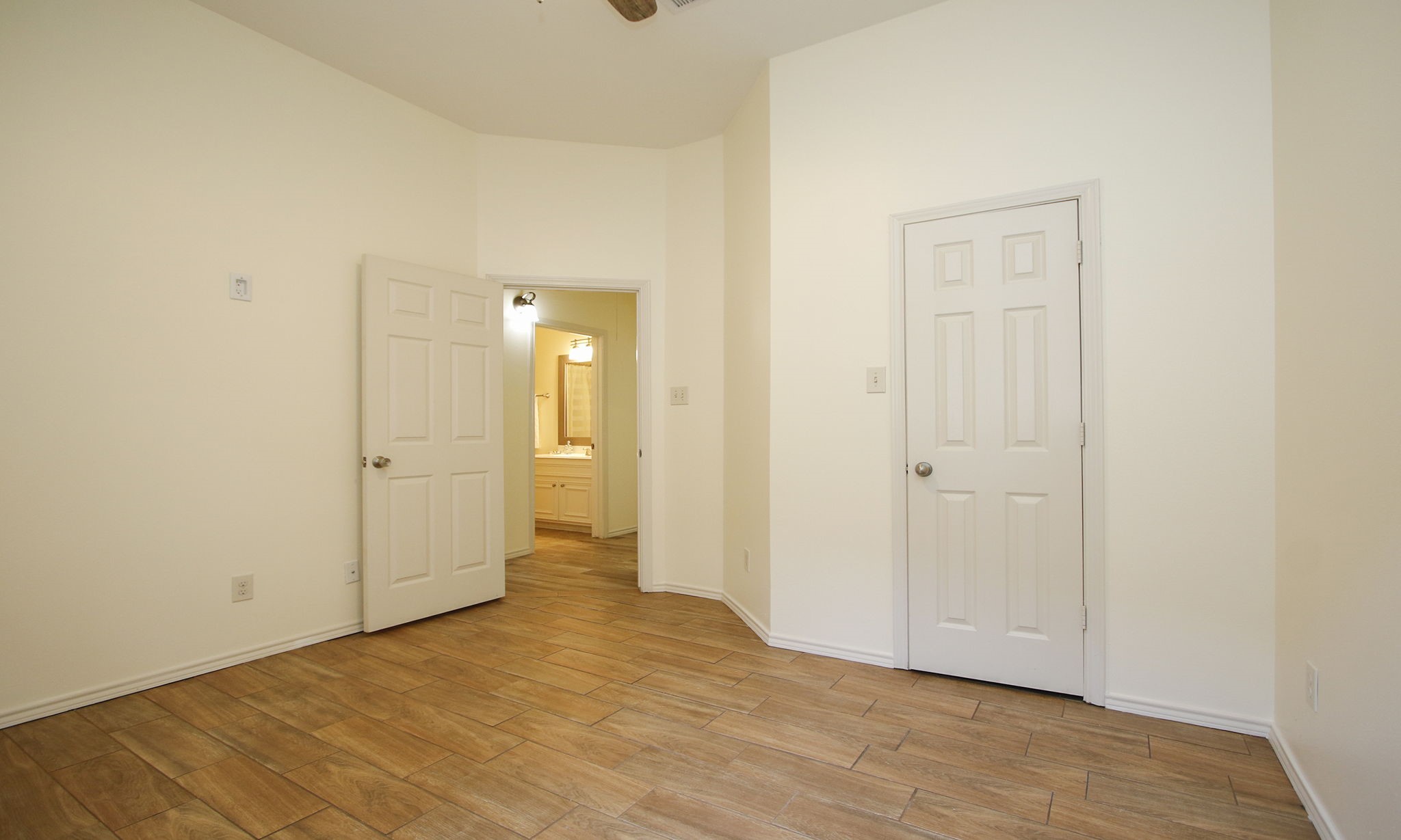 11123 Pembroke Ridge Drive Houston, TX 77065 - Photo 26 of 43 a view of a room with an empty space and wooden floor