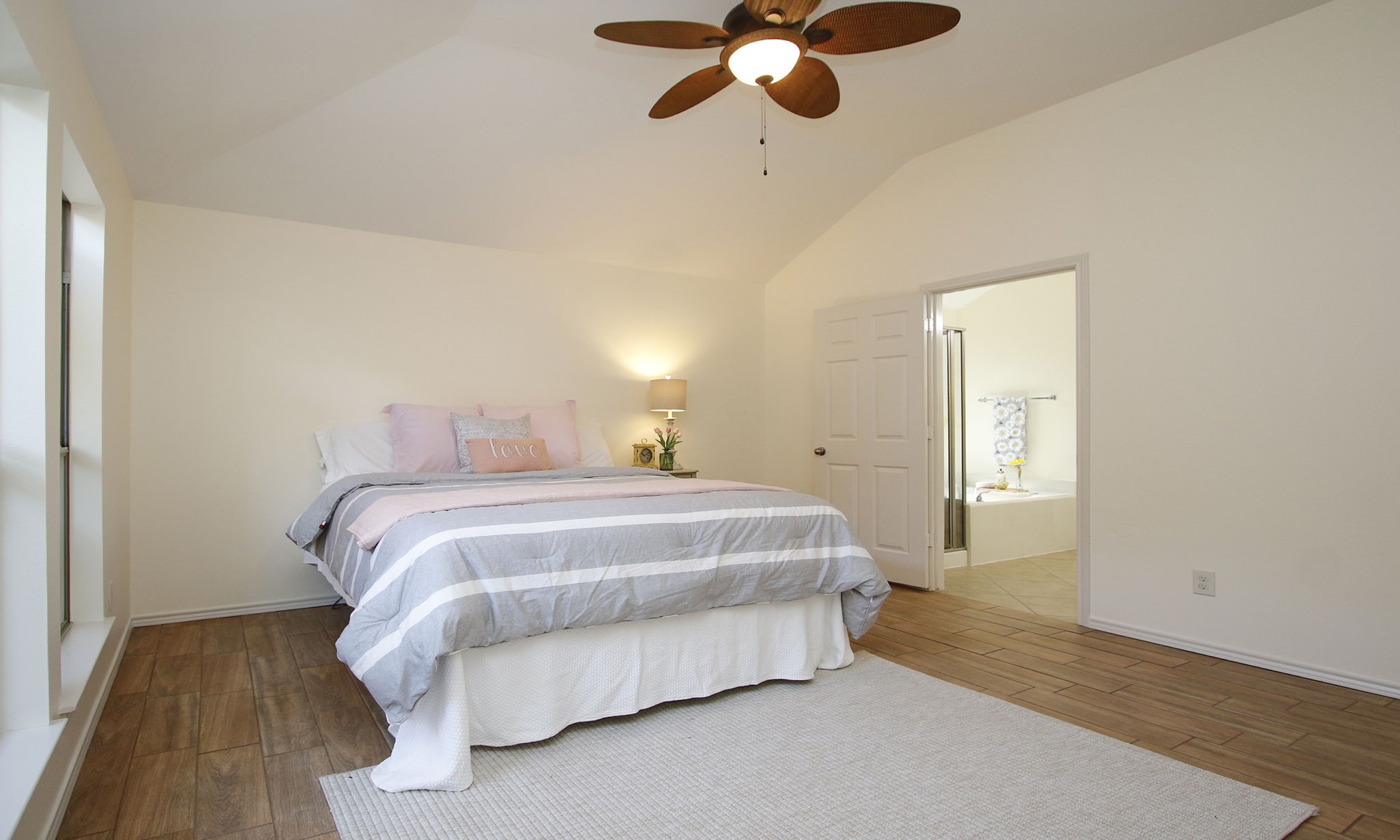 11123 Pembroke Ridge Drive Houston, TX 77065 - Photo 31 of 43 a bedroom with a bed and wooden floor