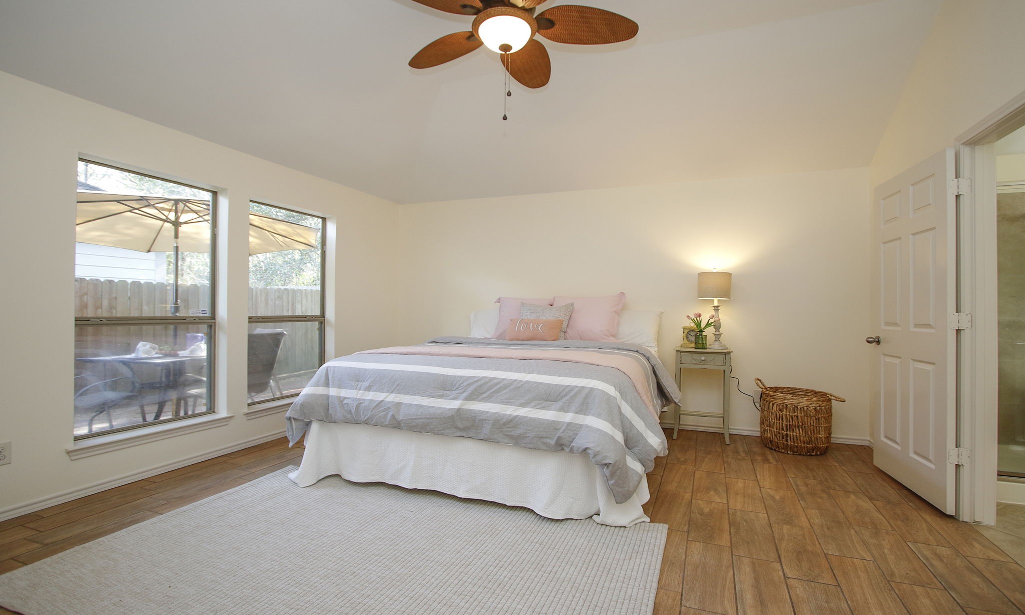 11123 Pembroke Ridge Drive Houston, TX 77065 - Photo 33 of 43 a spacious bedroom with a bed and wooden floor