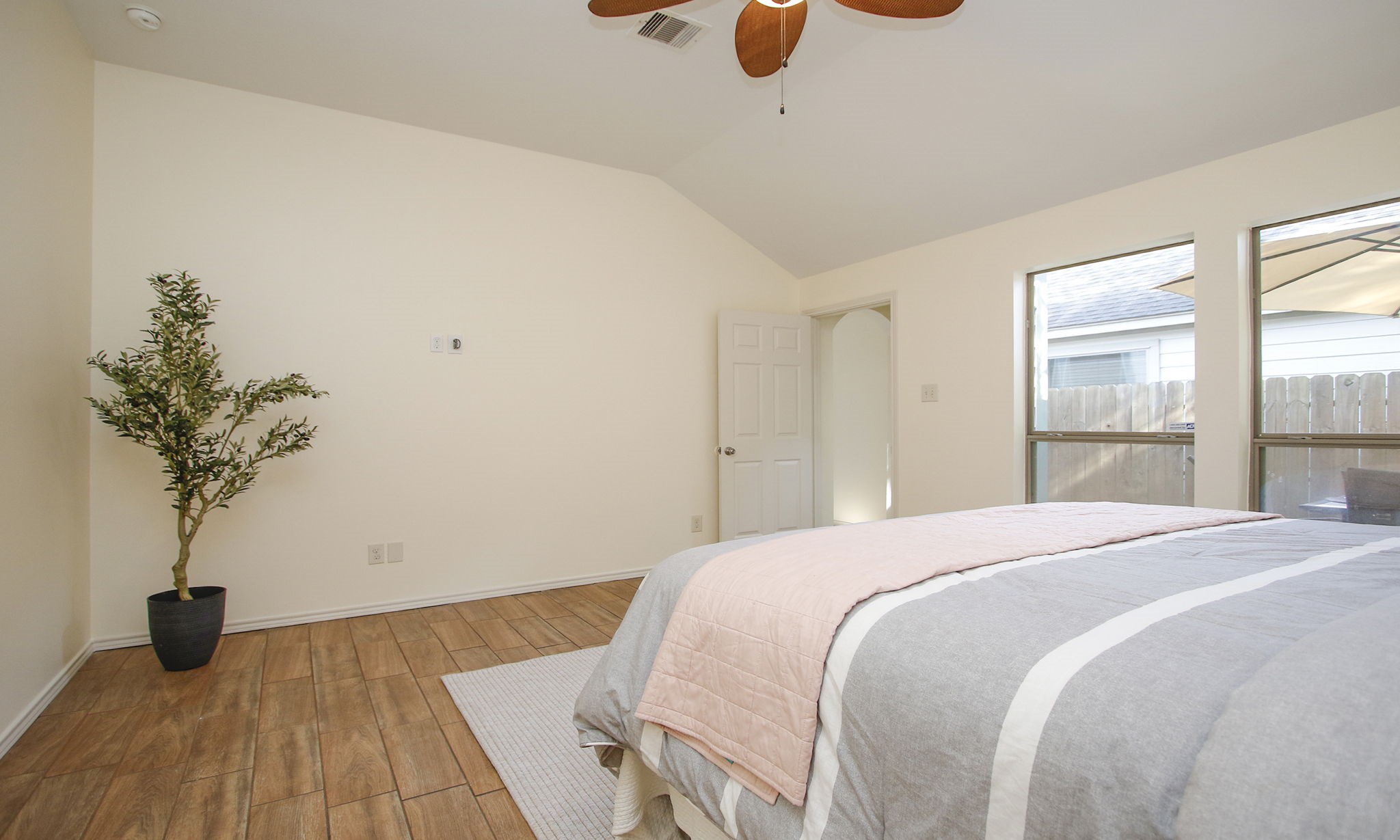 11123 Pembroke Ridge Drive Houston, TX 77065 - Photo 34 of 43 a bedroom with a bed and a potted plant