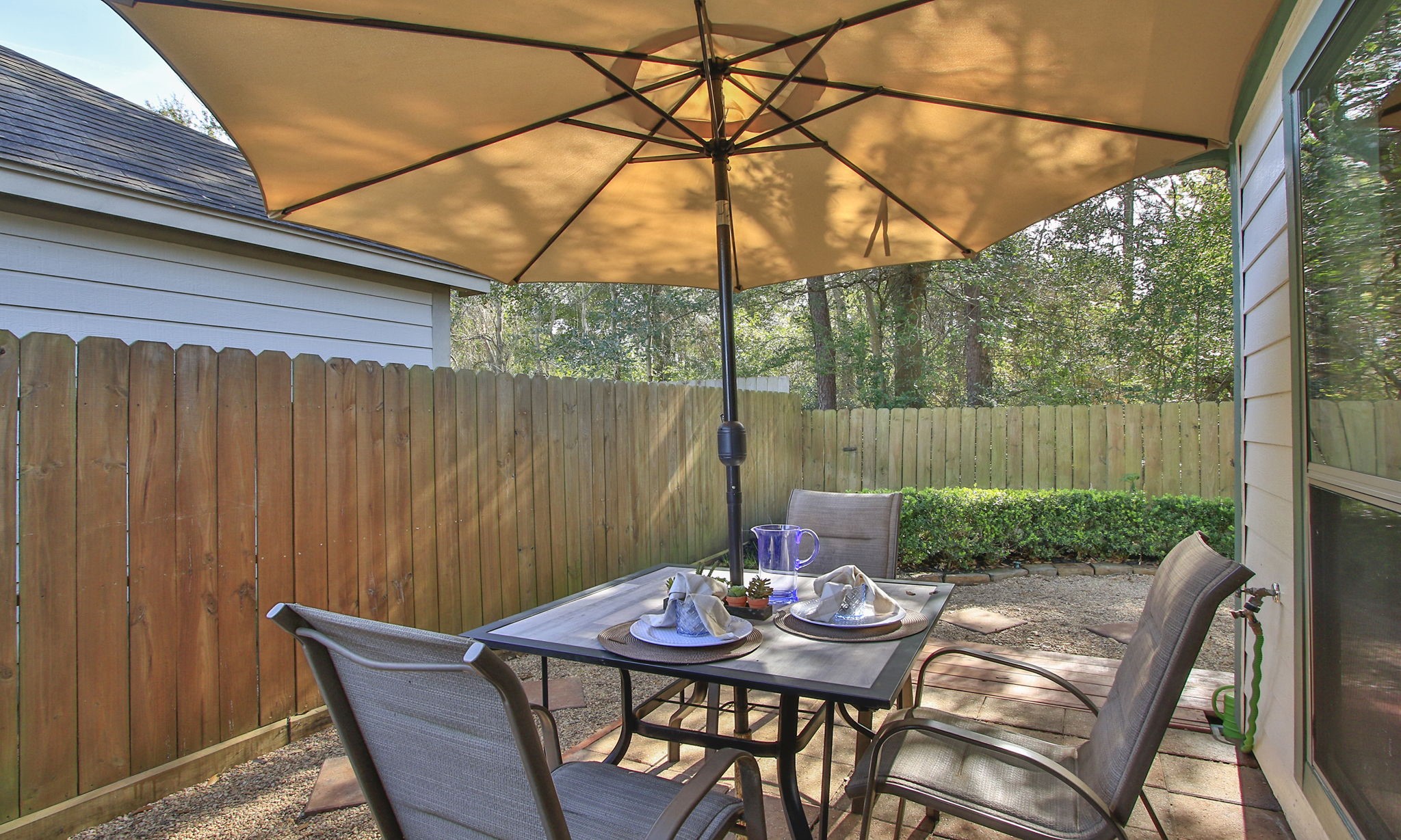 11123 Pembroke Ridge Drive Houston, TX 77065 - Photo 39 of 43 a backyard of a house with table and chairs