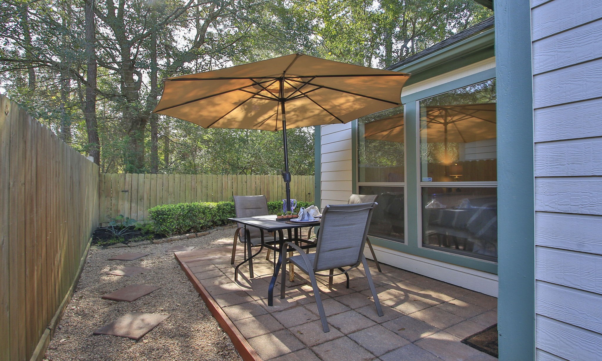 11123 Pembroke Ridge Drive Houston, TX 77065 - Photo 40 of 43 a backyard of a house with table and chairs