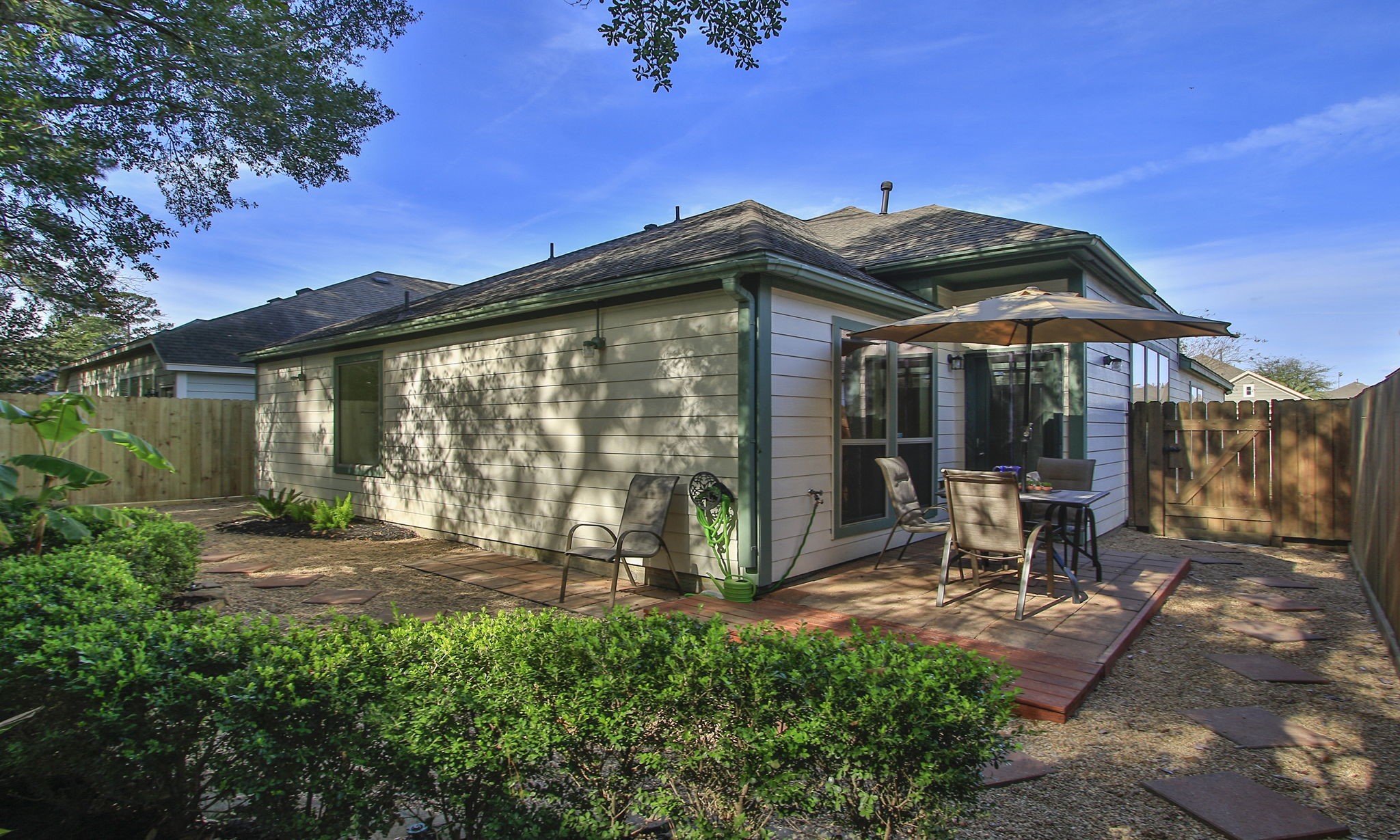 11123 Pembroke Ridge Drive Houston, TX 77065 - Photo 43 of 43 a view of a house with backyard sitting area and garden
