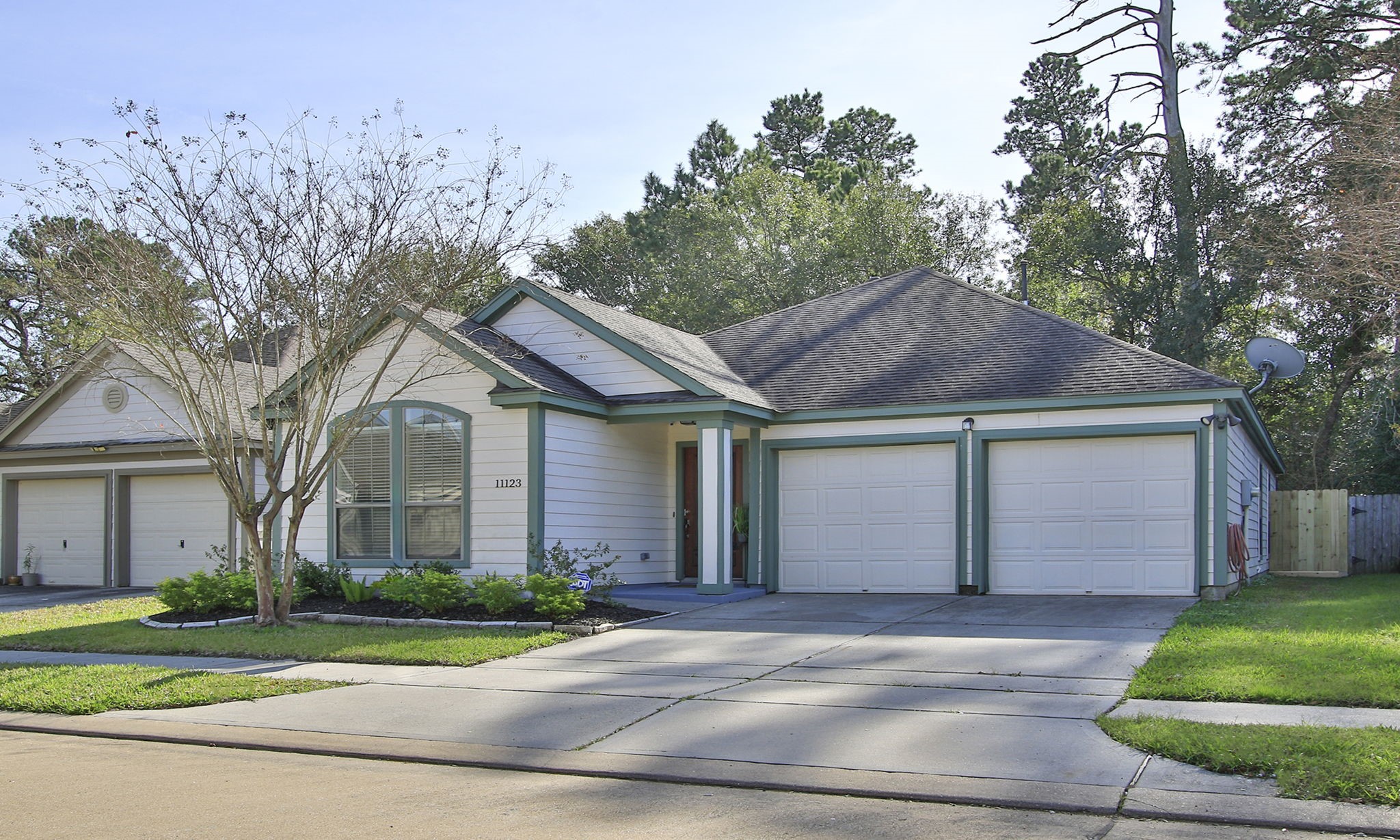 11123 Pembroke Ridge Drive Houston, TX 77065 - Photo 6 of 43 a front view of a house with a yard and garage