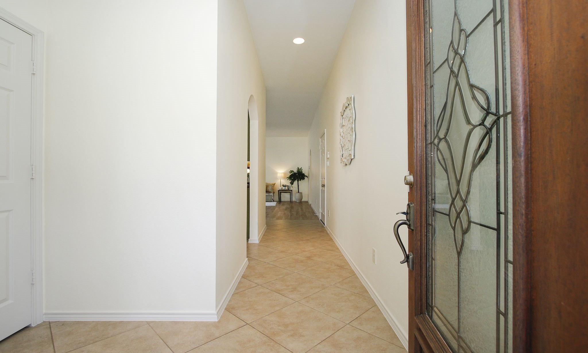 11123 Pembroke Ridge Drive Houston, TX 77065 - Photo 9 of 43 a view of a hallway with a glass door and furniture