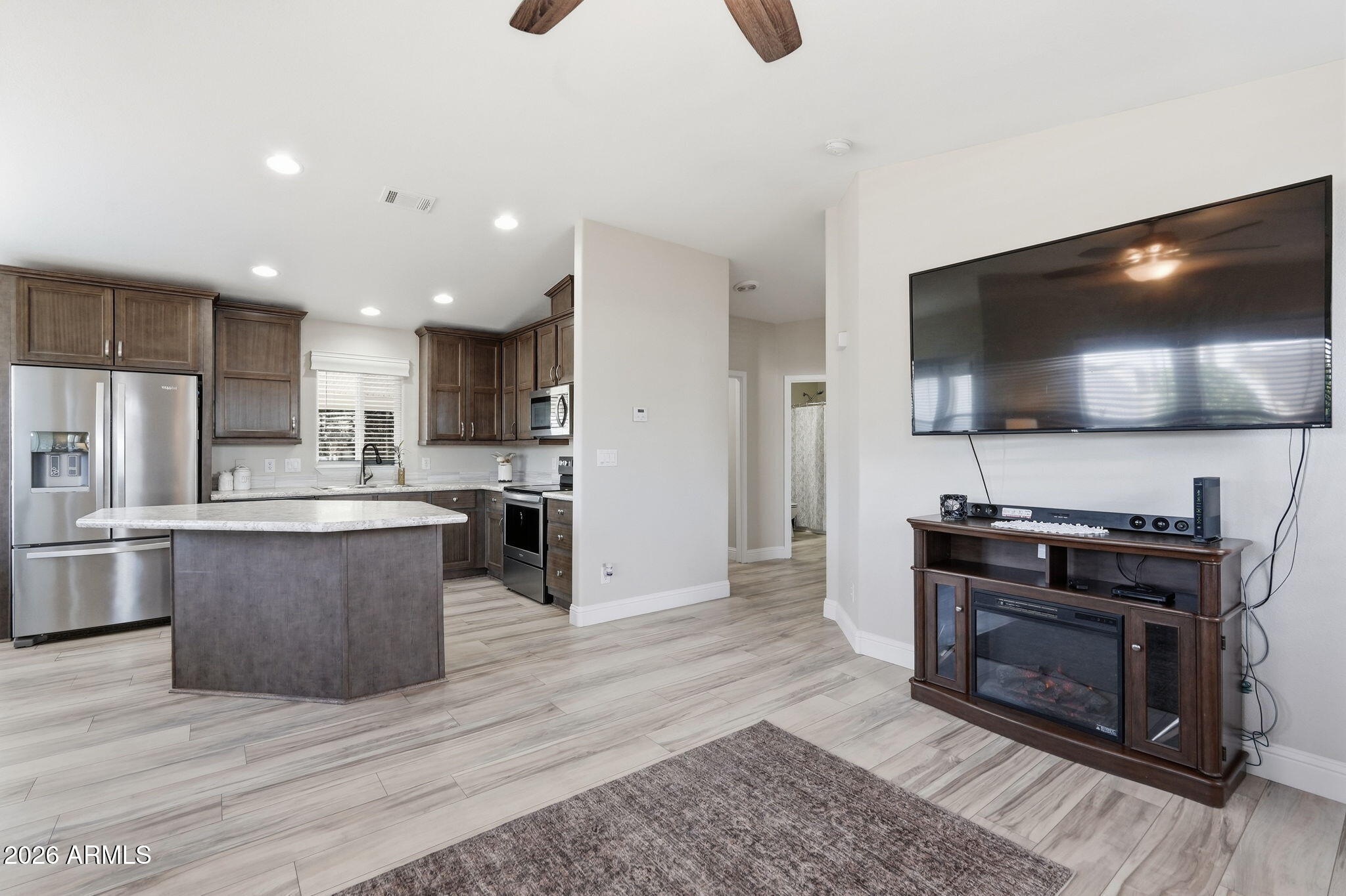 8865 East Baseline Road, Unit 1417 Mesa, AZ 85209 - Photo 11 of 47 a kitchen with a stove and a microwave