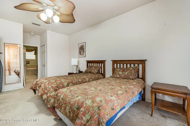 a bedroom with a bed and dresser