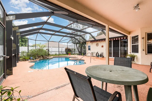 a view of a swimming pool with a patio