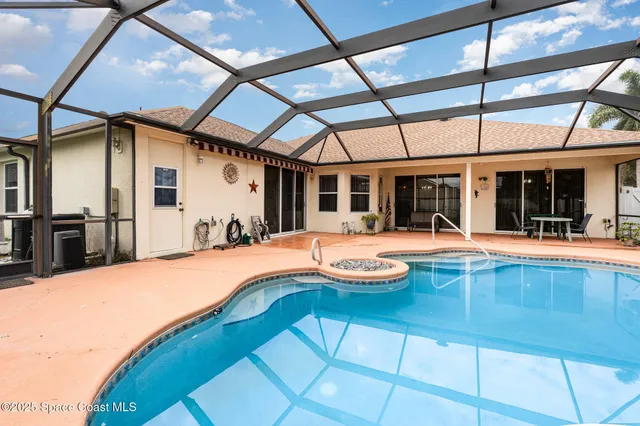 a view of swimming pool with patio