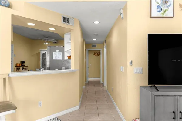 a view of a hallway view with wooden floor