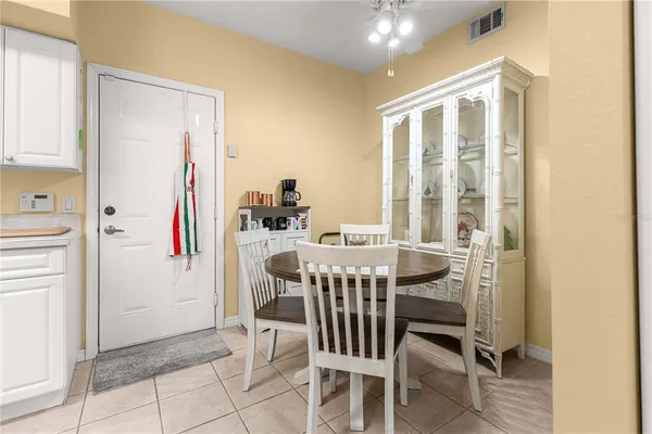 a view of a dining room with furniture and a window